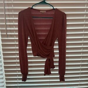 Pink stretch material Iris long sleeve Top that ties around the waist